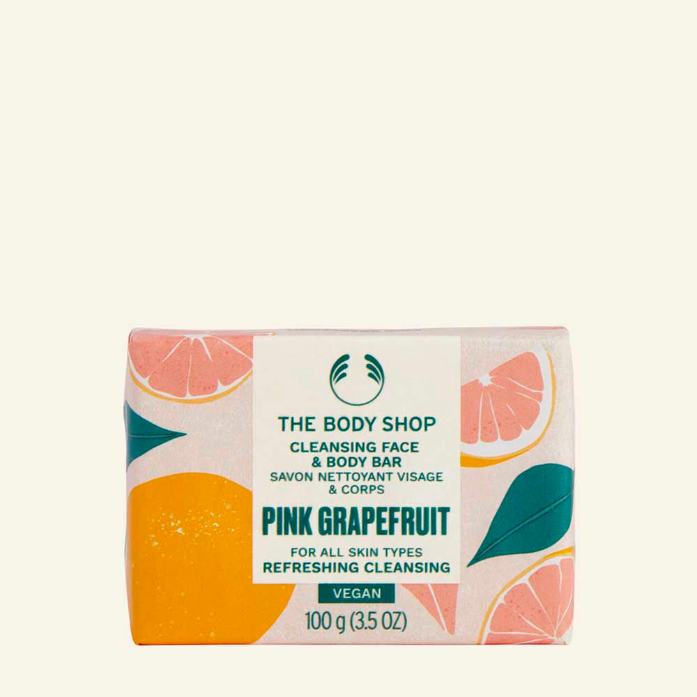 Jabón en barra de Toronja Rosa con fórmula natural, sostenible y certificado por The Vegan Society, que limpia y refresca rostro y cuerpo con aroma cítrico y enriquecido con manteca de karité de comercio justo