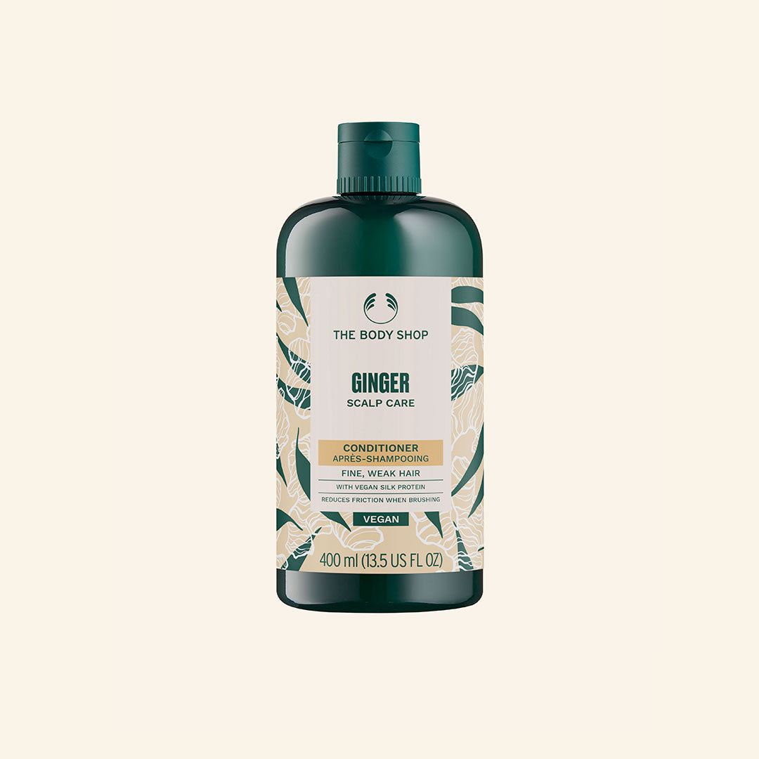 Acondicionador de Jengibre de 400 ml en botella, con ingredientes naturales como aceite esencial de jengibre, corteza de abedul, extracto de sauce blanco y aloe vera, diseñado para fortalecer cabello frágil y calmar cuero cabelludo seco y sensible