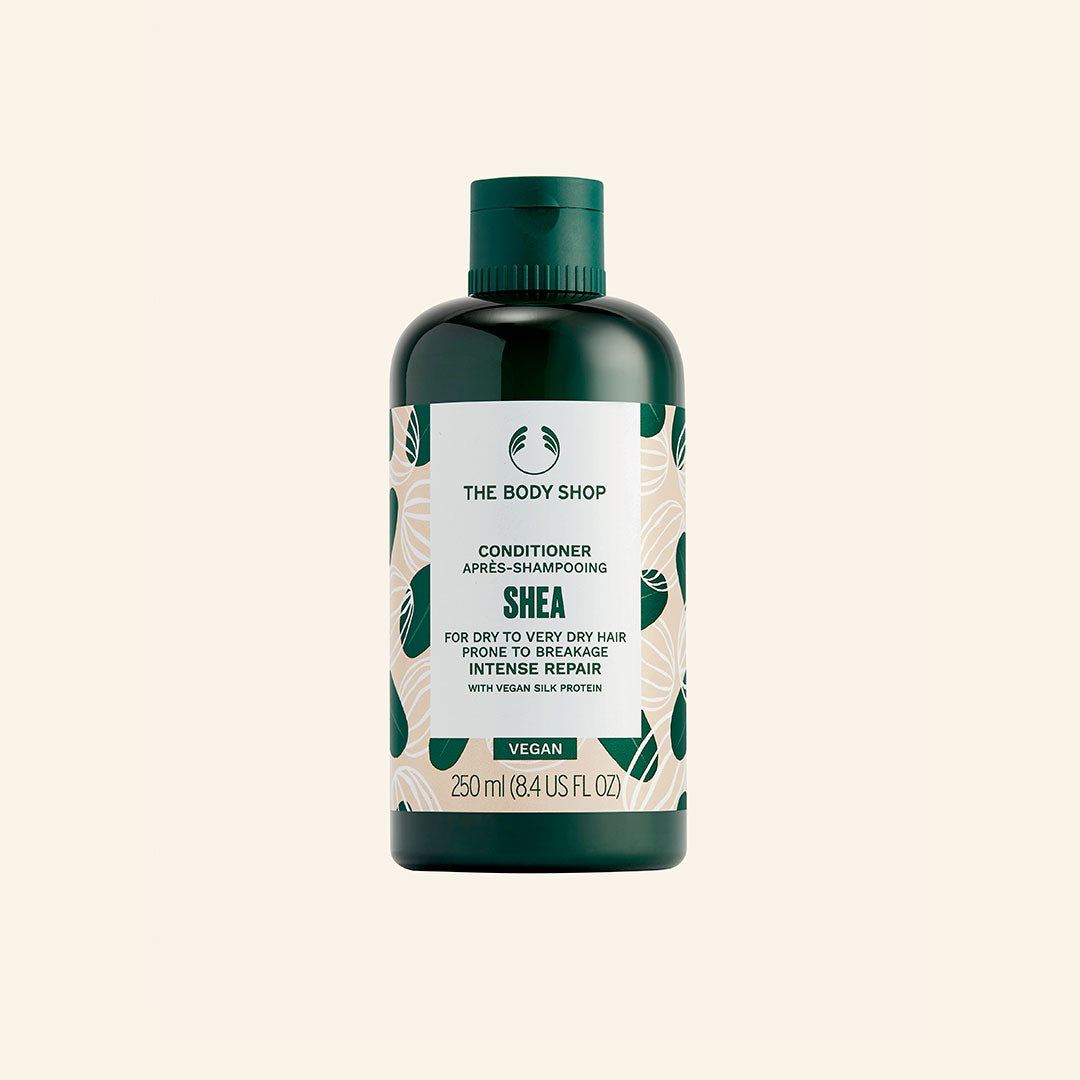 Acondicionador de 250 ml con manteca de karité de Ghana, textura cremosa y aroma a frutos secos para nutrir y reparar cabello seco y dañado