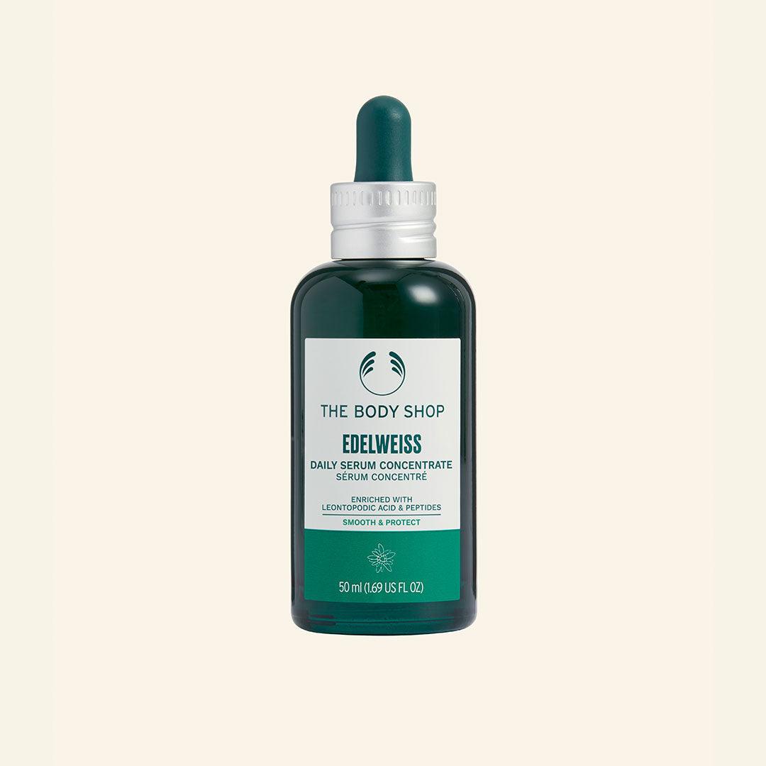 Imagen de una botella de 50 ml de Sérum Concentrado Edelweiss con extracto de edelweiss, diseñado para hidratar, proteger contra la contaminación ambiental y mantener la piel resiliente y radiante, en un envase de vidrio reciclado con un diseño elegante y moderno